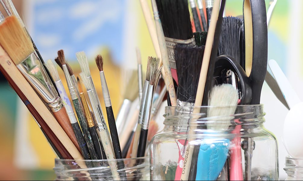 image of paintbrushes in jars
